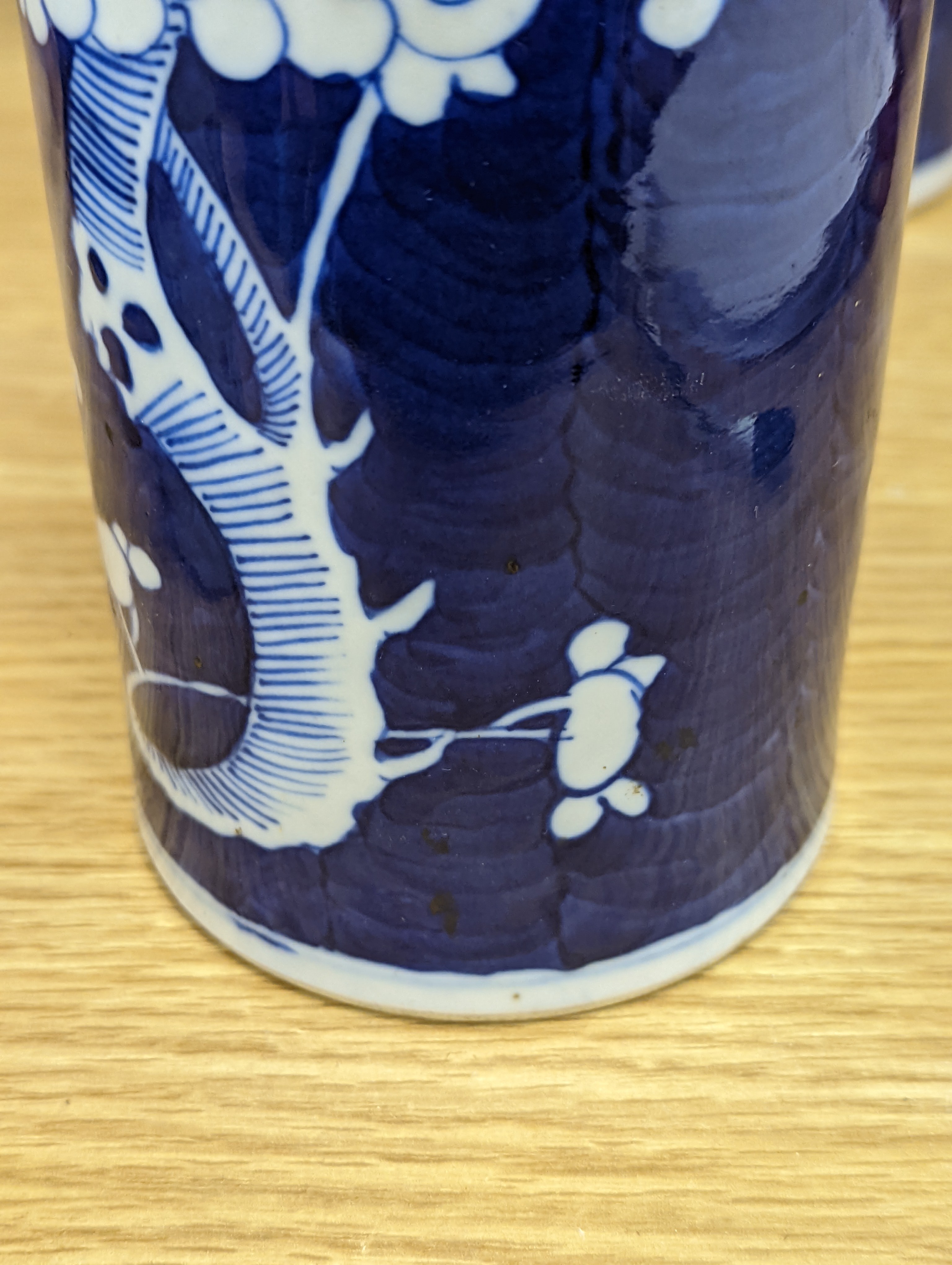 An 18th century Chinese famille rose mug, a Chinese Imari tea caddy and two Chinese blue and white sleeve vases 30cm (4)